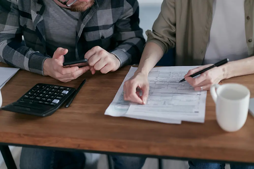 Couple working on Taxes together at a desk